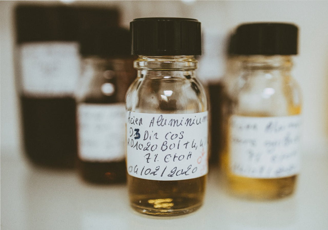 a selection of small fragrance sample bottles on a shelf
