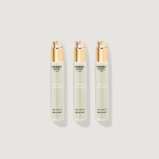 Three Creed Carmina 10ml Eau de Parfum atomiser refill vials with gold caps - Flat Lay | Creed Fragrances