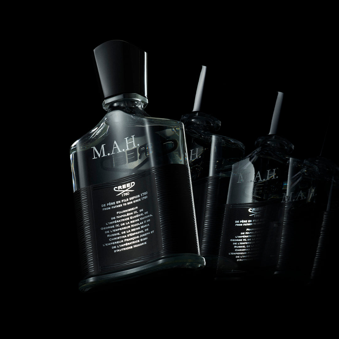 The back of a Creed Aventus bottle with personalisation with initials MAH