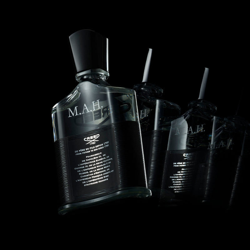 The back of a Creed Aventus bottle with personalisation with initials MAH