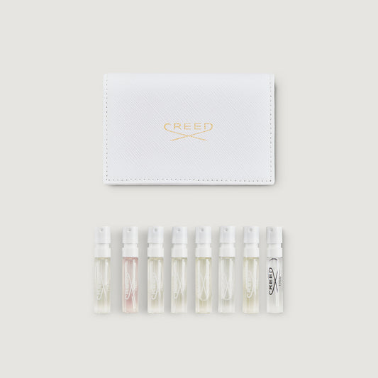 White Saffiano Leather Sample Wallet with 8 Women's Perfume Vials - Flat Lay | Creed Fragrances