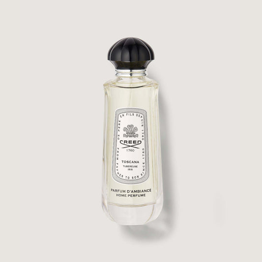 Clear glass Toscana Room Spray bottle with black dome cap and white label - Front View | Creed Fragrances